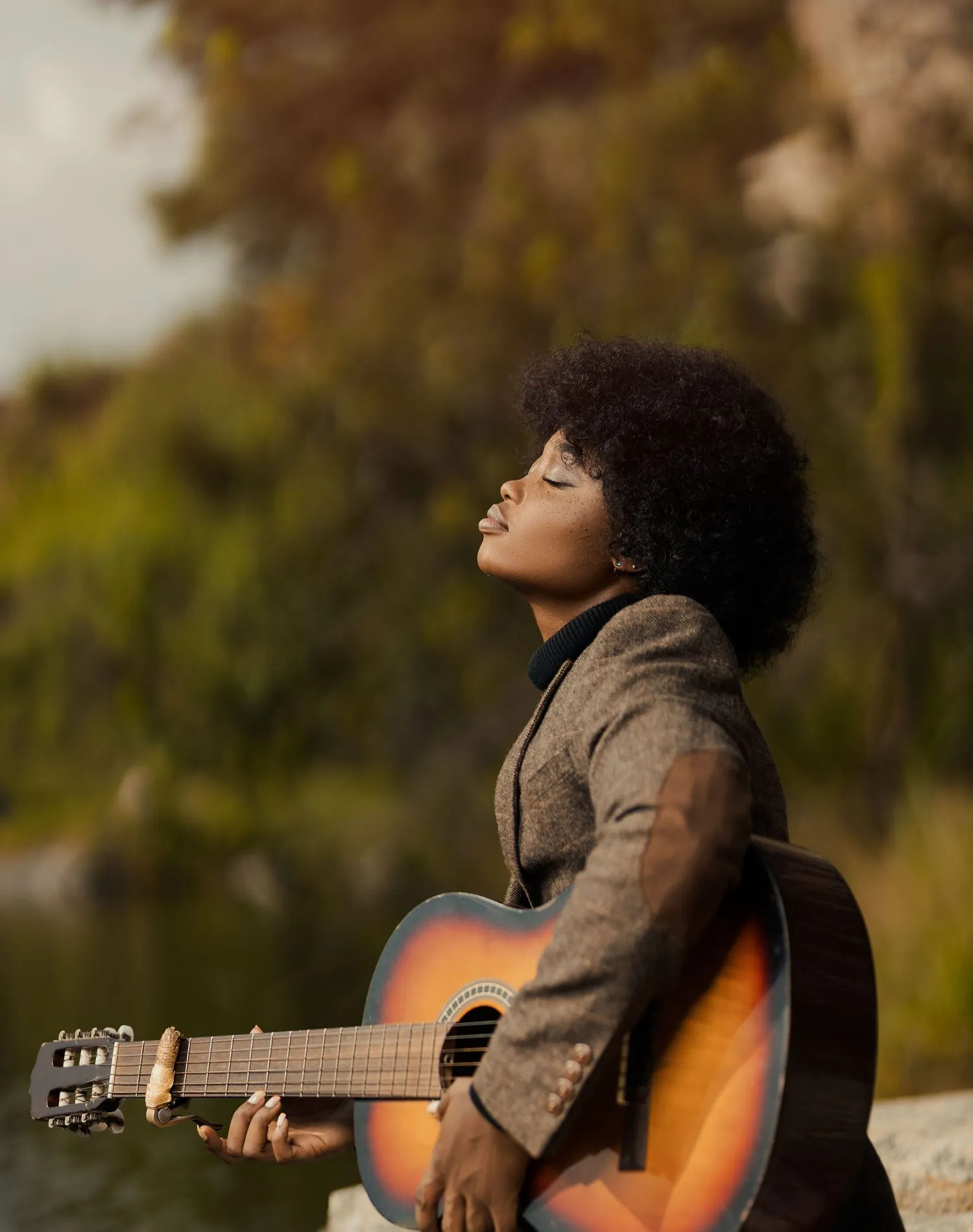 A creator with her guitar